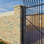 Concrete Fence Posts and Iron Gate