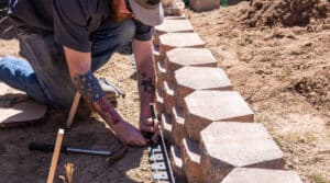 Contractor builds a retaining wall with precast concrete blocks from Harper Precast